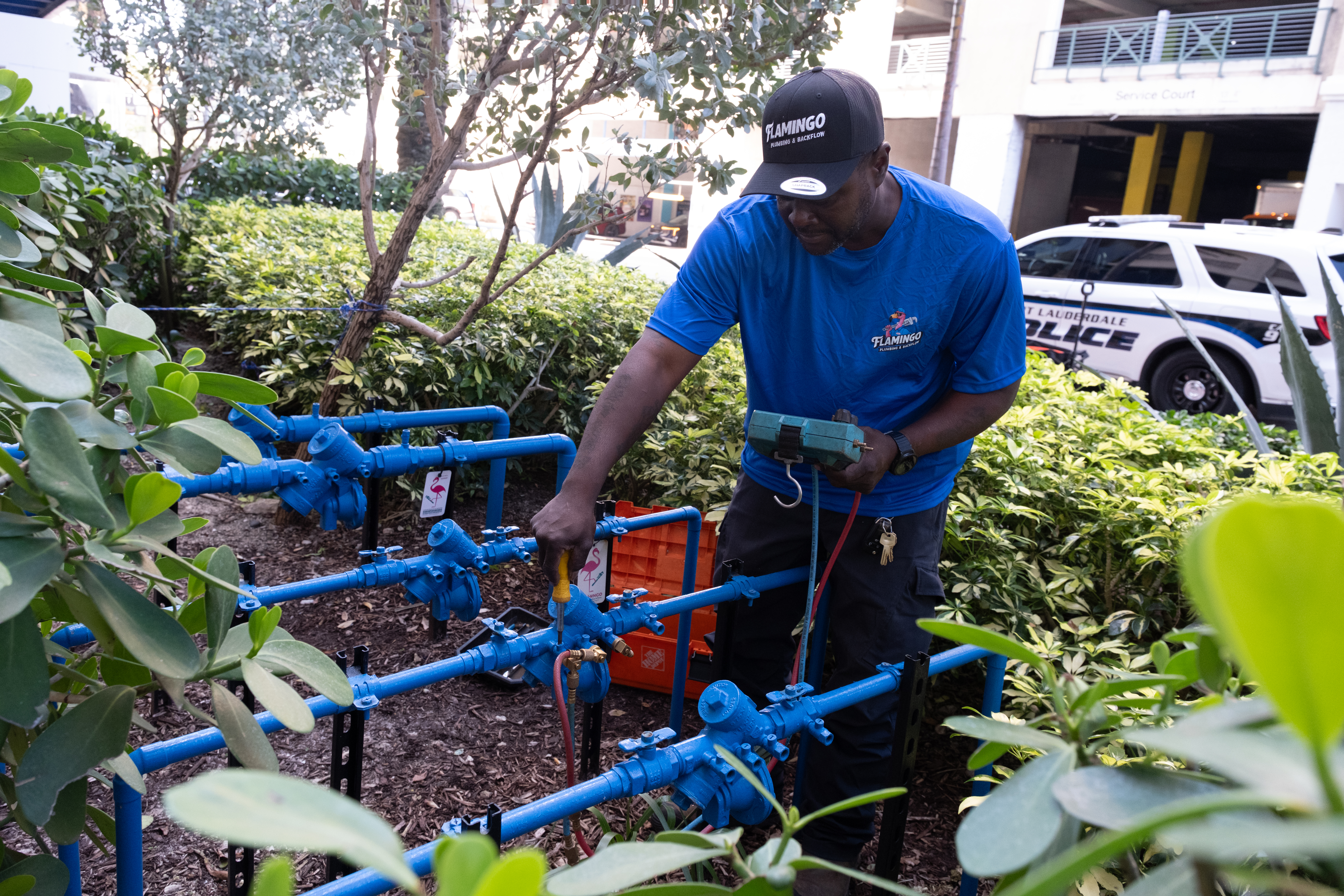 Flamingo technician servicing a commercial backflow system