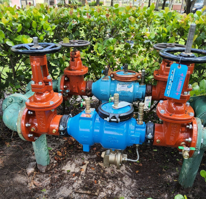 backflow valves outside of a building in florida