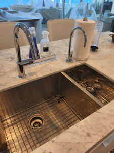kitchen sink and garbage disposal in a florida kitchen that is being remodeled