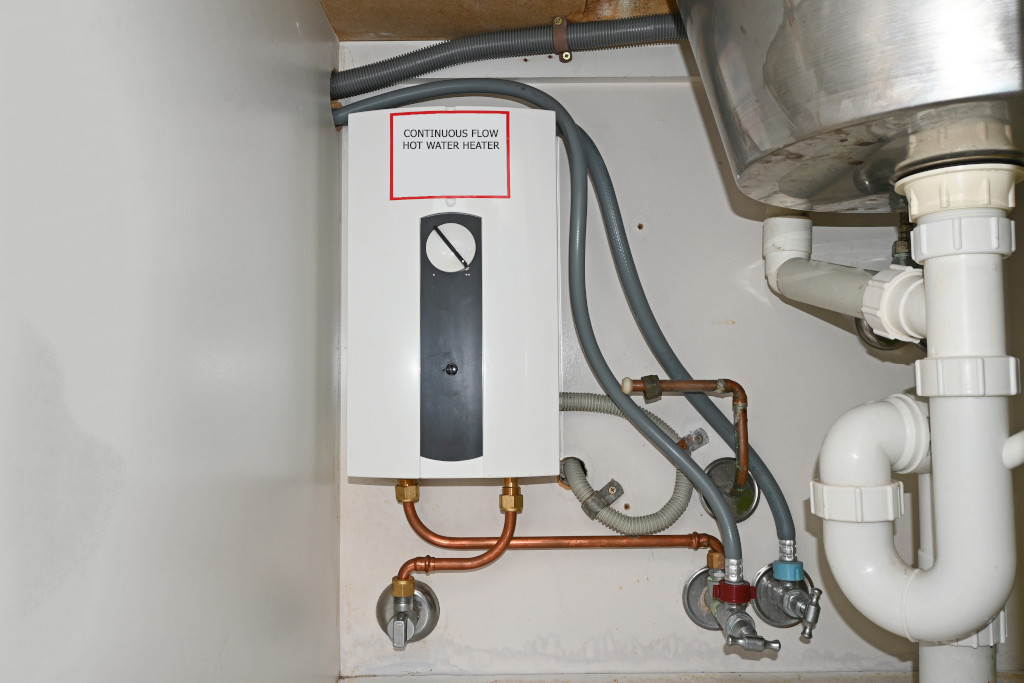 a tankless water heater below a sink